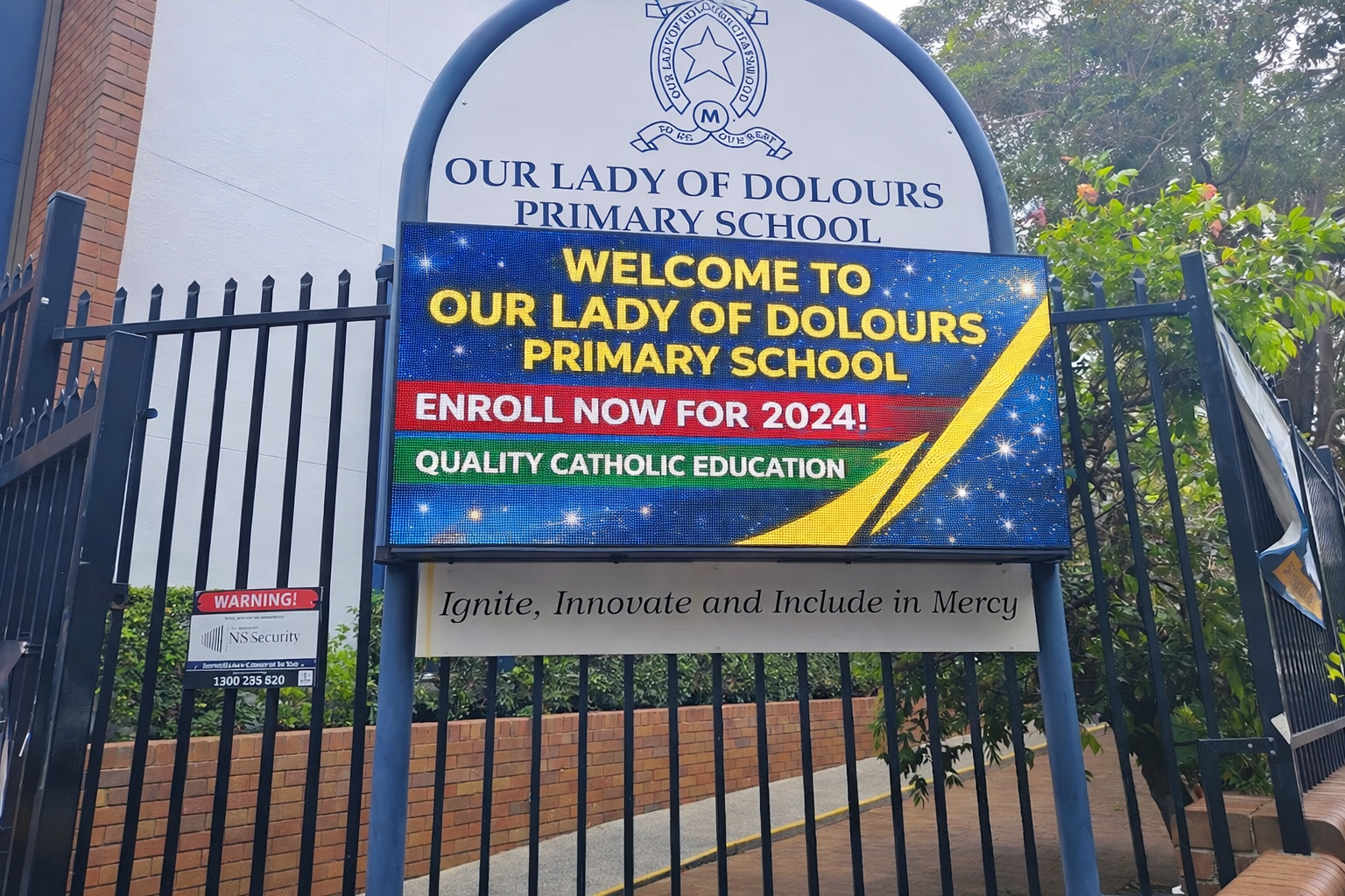 School LED sign installed at a school entrance